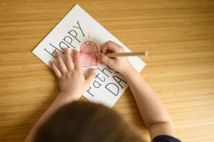 A child drawing on Happy Birthday card