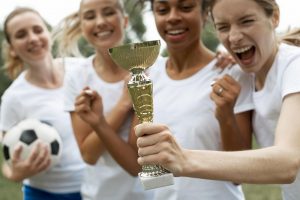 Women team holding a trophy