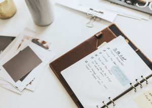 Daily planner on a messy desk