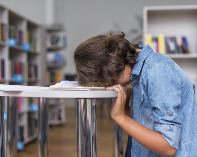 A child sleeping on his notebook