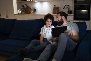 A child spending time with parents watching iPad