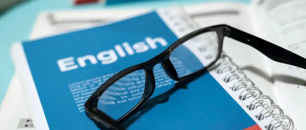 A booklet with the word English and eye glasses on it