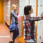 A girl opening school locker