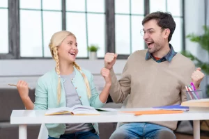 A father and a daughter celebrating success