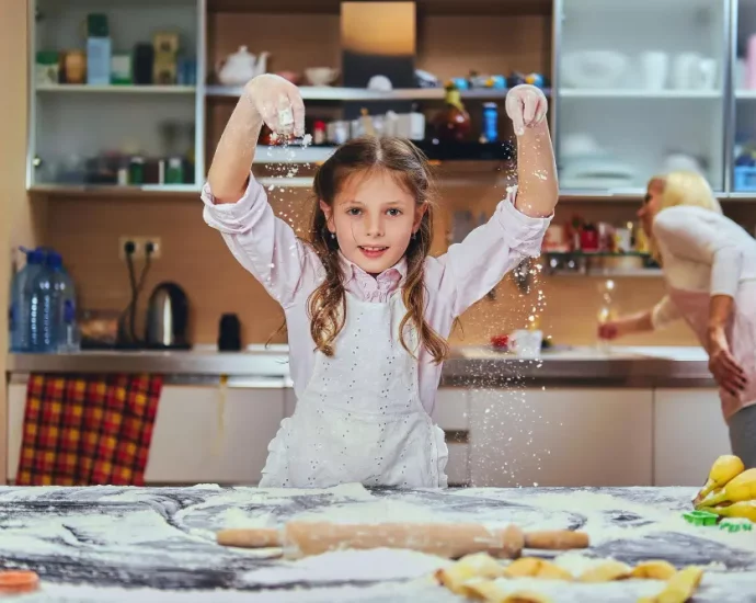 A child cooking cheerfully